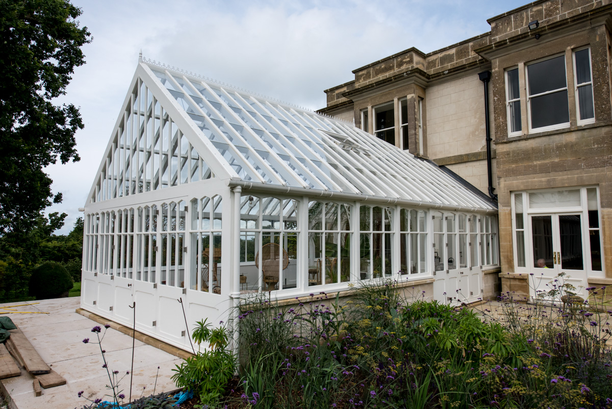 Exterior of white timber conservatory available in Bath and the South West